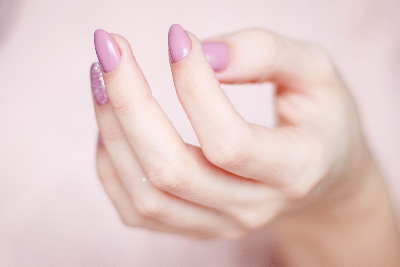 Close-up of glossy pink BIAB builder gel nails